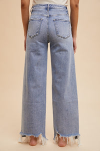 The Aftermath Distressed Hem Straight Leg Jeans in Denim Blue