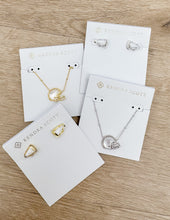 Load image into Gallery viewer, Kendra Scott Football Helmet Pendent Necklace in Gold/Ivory MOP